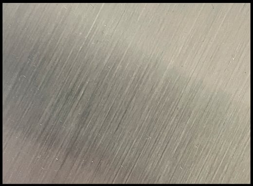 Close-up of the stainless steel chassis of a TSC-7010 computer